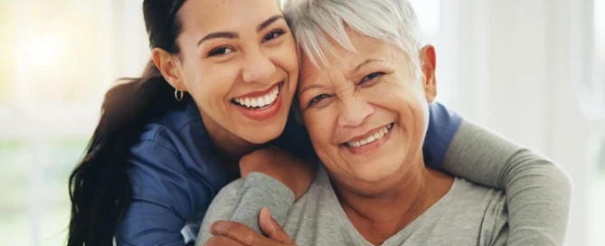 Hugging Senior On national Caregivers Day
